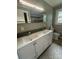 Bathroom showcasing a double vanity with a large mirror and updated fixtures for added convenience at 4524 Cinderella Rd, Charlotte, NC 28213