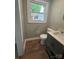Bathroom with a stylish vanity, contemporary toilet, and window letting in natural light at 4524 Cinderella Rd, Charlotte, NC 28213