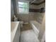 Bathroom featuring a modern vanity, new toilet, and a tiled shower-tub combination at 4524 Cinderella Rd, Charlotte, NC 28213