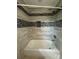 Modern bathtub and shower combination, featuring decorative tile and updated fixtures at 4524 Cinderella Rd, Charlotte, NC 28213