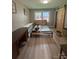 Bedroom featuring a modern bed frame and a wooden sliding barn door for a contemporary touch at 4524 Cinderella Rd, Charlotte, NC 28213