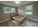 Bedroom featuring a bed frame, natural light from the windows, and a cozy atmosphere at 4524 Cinderella Rd, Charlotte, NC 28213
