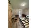 Bedroom with neutral walls, modern light fixture, a desk, and decor to create a cozy atmosphere at 4524 Cinderella Rd, Charlotte, NC 28213