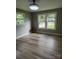 Bright bedroom featuring large windows and new flooring at 4524 Cinderella Rd, Charlotte, NC 28213