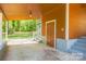 Spacious carport area with stairs leading to front entry at 4524 Cinderella Rd, Charlotte, NC 28213