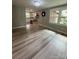 Dining room area with sleek floors and kitchen access, perfect for entertaining at 4524 Cinderella Rd, Charlotte, NC 28213