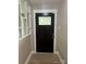 Stylish front door with glass insert and modern hardware at 4524 Cinderella Rd, Charlotte, NC 28213