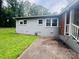 The home has a gray brick exterior and well maintained landscaping at 4524 Cinderella Rd, Charlotte, NC 28213