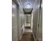 Hallway with sleek flooring and a decorative light fixture at 4524 Cinderella Rd, Charlotte, NC 28213