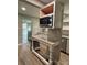 Stylish kitchen island with granite countertop and stainless steel microwave at 4524 Cinderella Rd, Charlotte, NC 28213