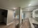 Open-concept kitchen layout with island and stainless steel appliances at 4524 Cinderella Rd, Charlotte, NC 28213