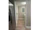 Hallway with a laundry room with modern appliances and flooring at 4524 Cinderella Rd, Charlotte, NC 28213