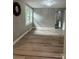 Open living room with modern lighting and hardwood floors at 4524 Cinderella Rd, Charlotte, NC 28213