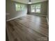 Bright living room featuring sleek floors, natural light and neutral walls at 4524 Cinderella Rd, Charlotte, NC 28213