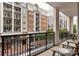 Relaxing balcony view with outdoor seating, showcasing cityscape vistas and urban living at 4620 Piedmont Row Dr # 308, Charlotte, NC 28210