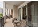 Private balcony with outdoor seating, perfect for enjoying city views and a morning coffee at 4620 Piedmont Row Dr # 308, Charlotte, NC 28210