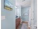Bathroom featuring a sink, toilet, towel racks and combination shower and tub at 4620 Piedmont Row Dr # 308, Charlotte, NC 28210