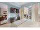 Bedroom with attached work space and balcony, offering a serene and functional area at 4620 Piedmont Row Dr # 308, Charlotte, NC 28210