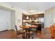 View of a well-appointed dining area with seamless access into a modern kitchen with stainless steel appliances at 4620 Piedmont Row Dr # 308, Charlotte, NC 28210