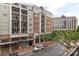 Exterior view of luxurious urban building with multiple balconies and landscaped surroundings at 4620 Piedmont Row Dr # 308, Charlotte, NC 28210
