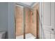 Shower stall featuring glass doors and tiled walls, with white shower floor at 4620 Piedmont Row Dr # 308, Charlotte, NC 28210