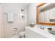Bathroom with white vanity, framed art, and neutral decor at 4924 Farm Pond Ln, Charlotte, NC 28212