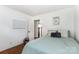 Cozy bedroom with hardwood floors, a comfortable bed, and ample natural light at 4924 Farm Pond Ln, Charlotte, NC 28212