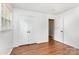 Bright bedroom featuring hardwood floors, ample closet space, and plenty of natural light at 4924 Farm Pond Ln, Charlotte, NC 28212