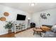 Cozy living room featuring hardwood floors, modern decor, and a comfortable seating area at 4924 Farm Pond Ln, Charlotte, NC 28212