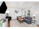 Bright living room showcasing a comfortable gray sofa, stylish decor, and natural light at 4924 Farm Pond Ln, Charlotte, NC 28212