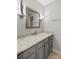 Bright bathroom featuring granite countertops and a neutral colored vanity with gray walls and tiled floors at 5016 Celeste Ct, Charlotte, NC 28270