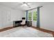 Bedroom featuring a desk and chair with hard wood floors, neutral colored walls, and blue curtains at 5016 Celeste Ct, Charlotte, NC 28270