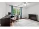 Bedroom featuring a desk and chair with hard wood floors, neutral colored walls, and blue curtains at 5016 Celeste Ct, Charlotte, NC 28270