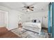 Bedroom with hardwood floors, a comfy queen-sized bed and a ceiling fan for added comfort at 5016 Celeste Ct, Charlotte, NC 28270