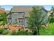 Sprawling backyard featuring an outdoor seating area, manicured landscaping, and lush greenery at 5044 Dockside Ct, Matthews, NC 28104