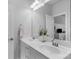 Bathroom with double sinks, granite countertop, large mirror, and brushed nickel fixtures at 5044 Dockside Ct, Matthews, NC 28104