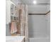 White bathroom with updated tile and shower with tub, a sleek shower curtain and decor at 5044 Dockside Ct, Matthews, NC 28104