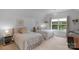 Bright bedroom featuring two twin beds, neutral walls, and a window with natural light at 5044 Dockside Ct, Matthews, NC 28104