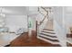 Grand foyer featuring hardwood floors, a staircase, and views into the living areas at 5044 Dockside Ct, Matthews, NC 28104