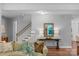 Elegant foyer with hardwood floors, a staircase, and a view into the adjacent living area at 5044 Dockside Ct, Matthews, NC 28104