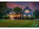 Charming two-story home with a welcoming front porch, landscaped yard, and professionally maintained lawn at 5044 Dockside Ct, Matthews, NC 28104