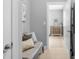 Hallway with neutral decor, tiled floors, leading to a bright entryway with natural light at 5044 Dockside Ct, Matthews, NC 28104