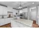 Bright kitchen with white cabinets, stainless steel appliances, and large island at 5044 Dockside Ct, Matthews, NC 28104