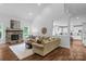 Spacious living room with a stone fireplace, hardwood floors, and comfortable seating at 5044 Dockside Ct, Matthews, NC 28104