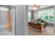 Serene home office with natural light streaming through the windows and a connected bathroom at 5044 Dockside Ct, Matthews, NC 28104