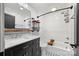Updated bathroom featuring sleek fixtures, a shower-tub combo, and a stylish vanity at 605 Cobb St, Lowell, NC 28098