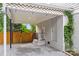 Carport features a lattice covering with hanging lights and climbing vines at 605 Cobb St, Lowell, NC 28098