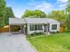 Charming home with well-manicured lawn, carport, and updated exterior at 605 Cobb St, Lowell, NC 28098