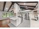 Bright kitchen with island, stainless steel appliances, white cabinetry, and a stylish backsplash at 605 Cobb St, Lowell, NC 28098