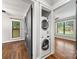 Convenient laundry area with stackable washer and dryer, adjacent to other rooms at 605 Cobb St, Lowell, NC 28098
